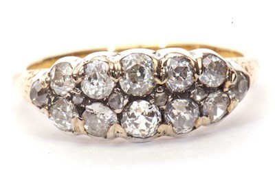 Lot 1 - Diamond cluster ring, a design featuring two...