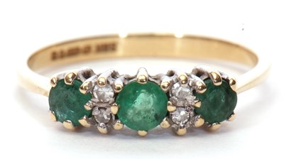 Lot 14 - 9ct gold emerald and diamond ring, the design...