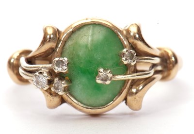 Lot 21 - 9ct gold jade and diamond ring, the oval...