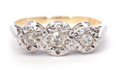 Lot 39 - A three stone diamond ring featuring three...