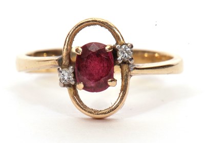 Lot 61 - Modern ruby and diamond ring, the oval faceted...