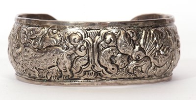 Lot 108 - Metal torque bangle decorated with dragons and...