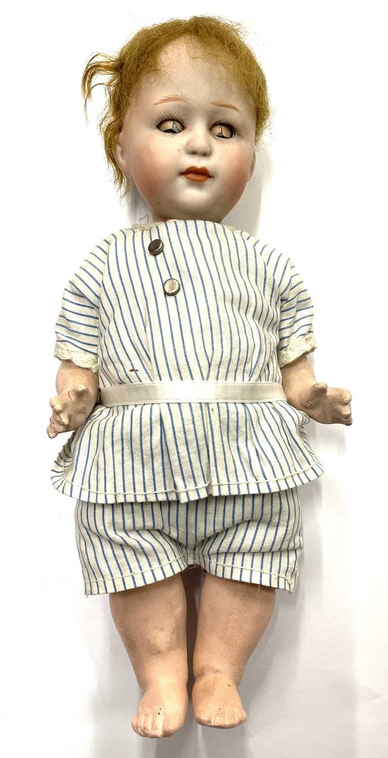 Lot 97 A rare Heubach bisque head doll, in striped