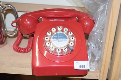 Lot 555 - Vintage red telephone