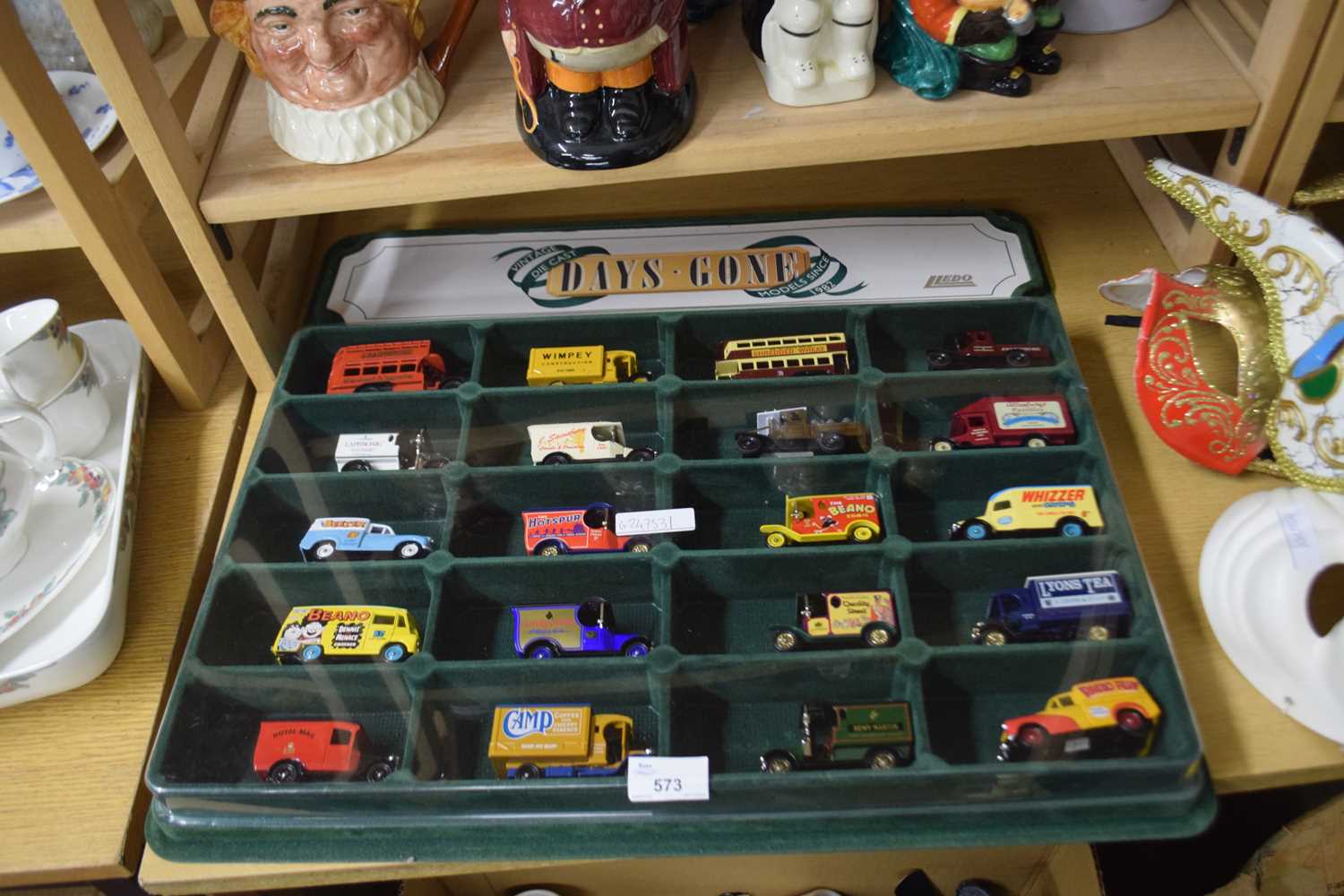 Lot 573 - Lledo display of model vans and buses