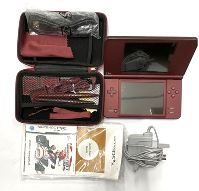 Lot 225 - A burgundy Nintendo DS XL console in case with...