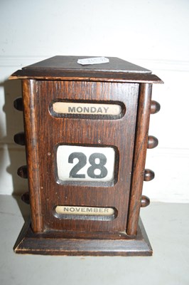 Lot 48 - Small oak perpetual calendar, 18cm high