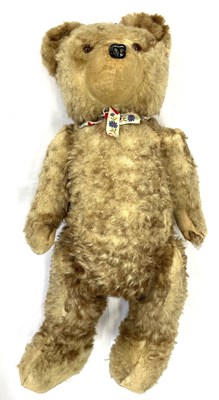 Lot 153 - A vintage straw-stuffed teddy bear, no maker's...