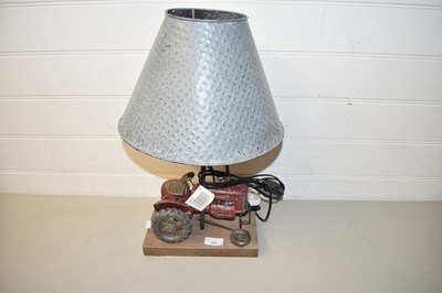 Lot 101 - Modern table lamp, the base formed as a tractor