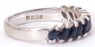 Lot 6 - Modern 18ct white gold and sapphire half hoop...