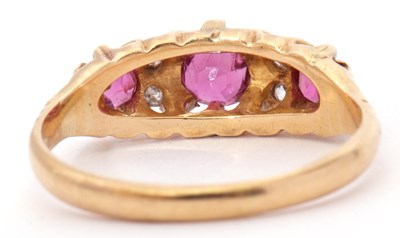 Lot 9 - Antique ruby and diamond ring featuring three...