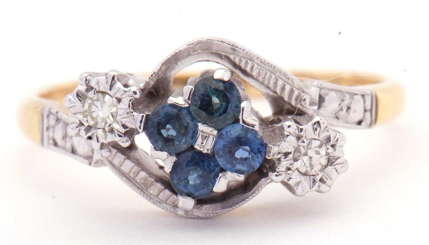 Lot 12 - 18ct gold sapphire and diamond cross over ring,...
