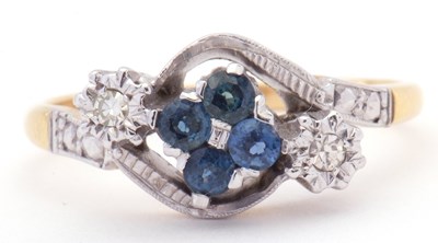 Lot 12 - 18ct gold sapphire and diamond cross over ring,...