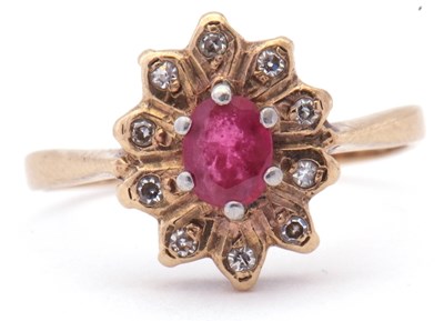 Lot 13 - 9ct gold ruby and diamond cluster ring, the...