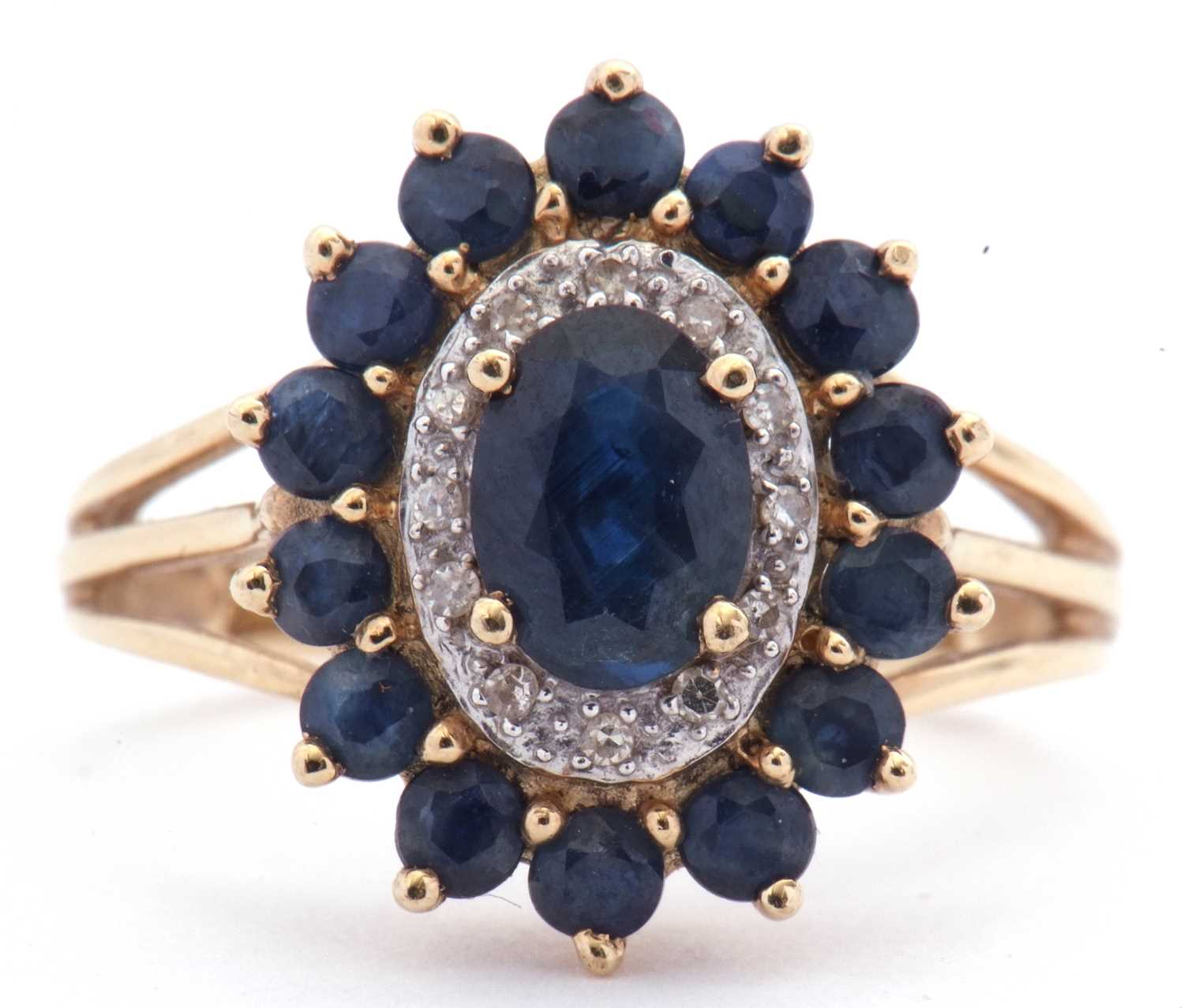 Lot 21 - Modern sapphire and diamond cluster ring...