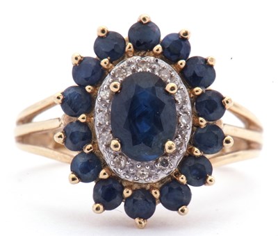 Lot 21 - Modern sapphire and diamond cluster ring...