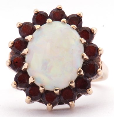 Lot 23 - 9ct gold opal and garnet cluster dress ring,...
