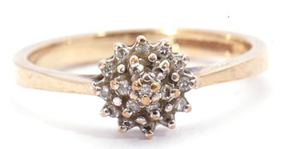 Lot 28 - 9ct gold and diamond cluster ring, a design...