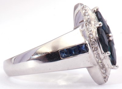 Lot 35 - Modern sapphire and diamond cluster ring...