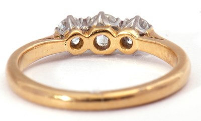 Lot 39 - Three stone diamond ring featuring three small...