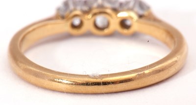 Lot 39 - Three stone diamond ring featuring three small...