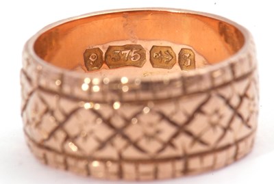 Lot 48 - 9ct gold wide band ring, a continuous chased...