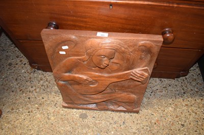 Lot 305 - Carved hardwood wall plaque of a mandolin player