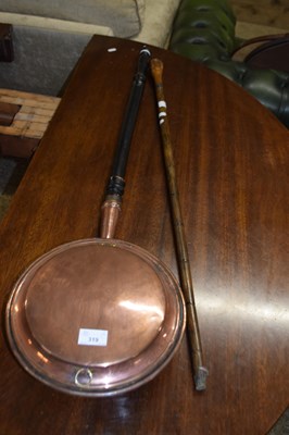 Lot 319 - Copper bed warming pan and a walking stick