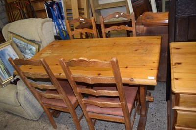 Lot 354 - Rectangular pine kitchen table and four chairs