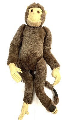 Lot 152 - A cheeky vintage straw-stuffed monkey. Some...