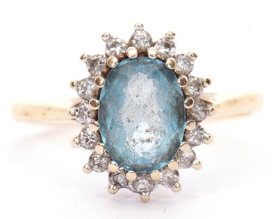 Lot 10A - Light blue stone and diamond cluster ring, the...