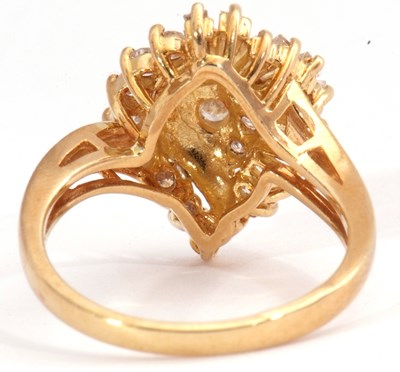 Lot 95 - 18ct gold and diamond cluster ring, a swirl...
