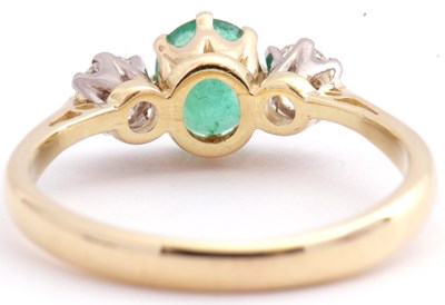 Lot 110 - 18ct gold emerald and diamond three stone ring,...