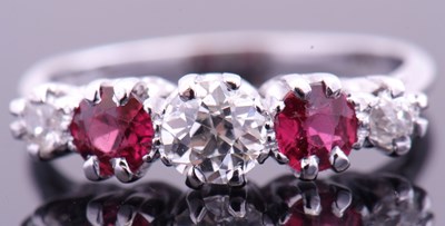 Lot 113 - Diamond and ruby five stone ring centring a...