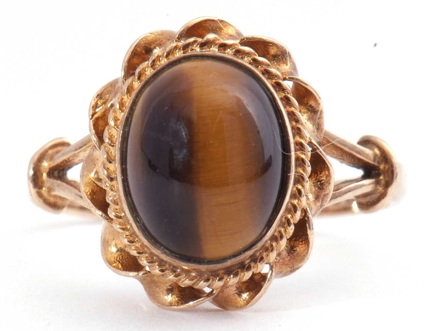 Lot 116 - 9ct gold tigers eye ring, the cabochon stone...