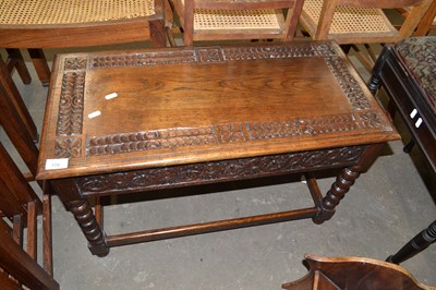 Lot 770 - Carved oak coffee table