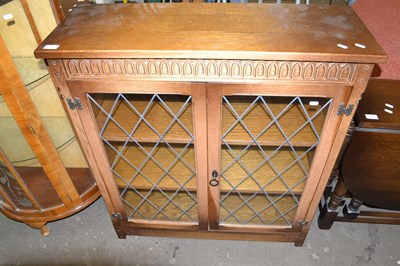Lot 855 - Modern oak lead glazed bookcase cabinet