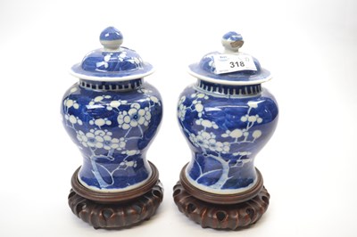 Lot 318 - Two small Chinese porcelain jars and covers...