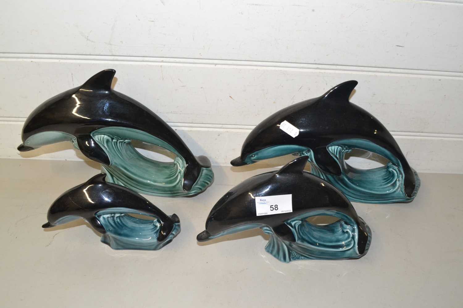 Lot 58 - Four various Poole dolphins