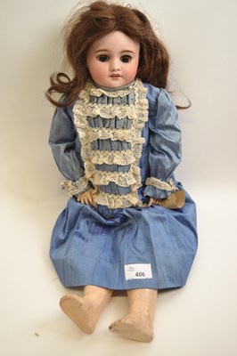 Lot 406 - SFBJ doll in blue dress, 53cm long