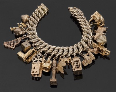 Lot 364 - .333 german gold charm bracelet with 9ctgold...