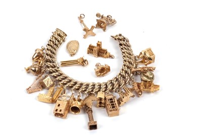 Lot 364 - .333 german gold charm bracelet with 9ctgold...