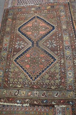 Lot 657 - Small caucasian wool rug decorated with...
