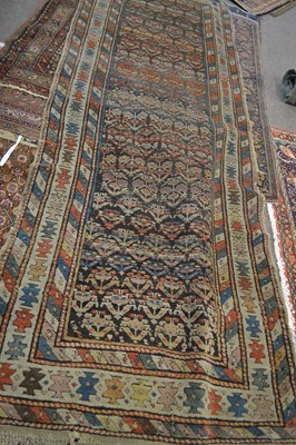 Lot 659 - Caucasian wool rug with central panel...