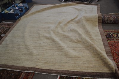 Lot 656 - Afghan contemporary rug in pale neutral...