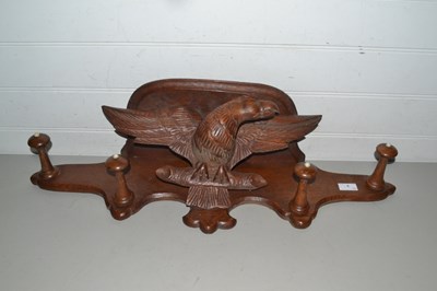 Lot 3 - Continental hardwood coat rack decorated with...