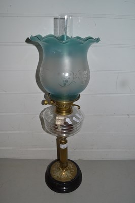 Lot 10 - Brass based oil lamp with frosted glass shade