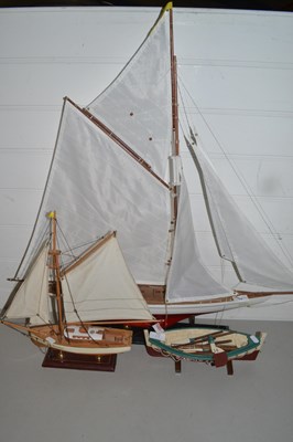 Lot 15 - Two model yachts and a further model rowing...