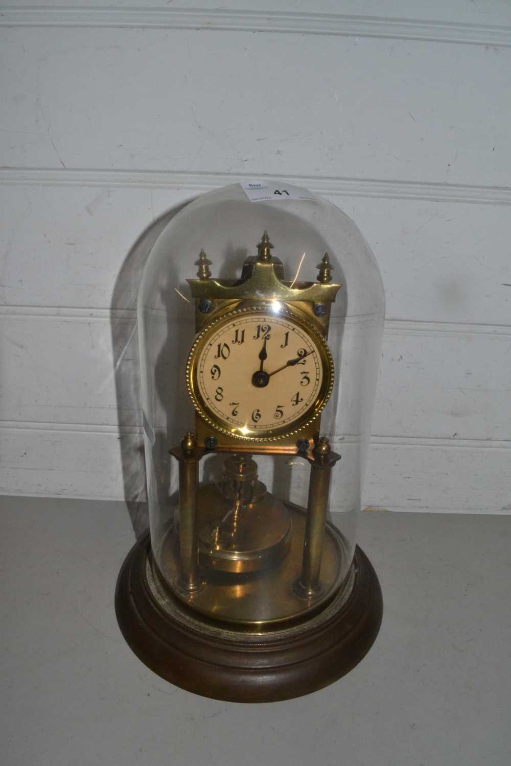 Lot 41 Brass anniversary clock under glass dome