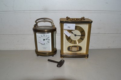 Lot 71 - Oval brass cased carriage clock marked Pidduck...